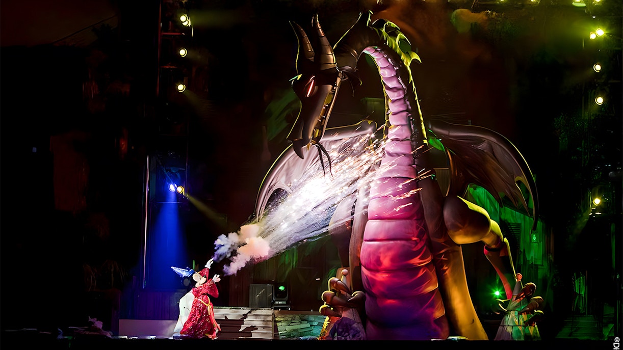 Mickey battling a dragon during a live show at Disneyland Park, California.
