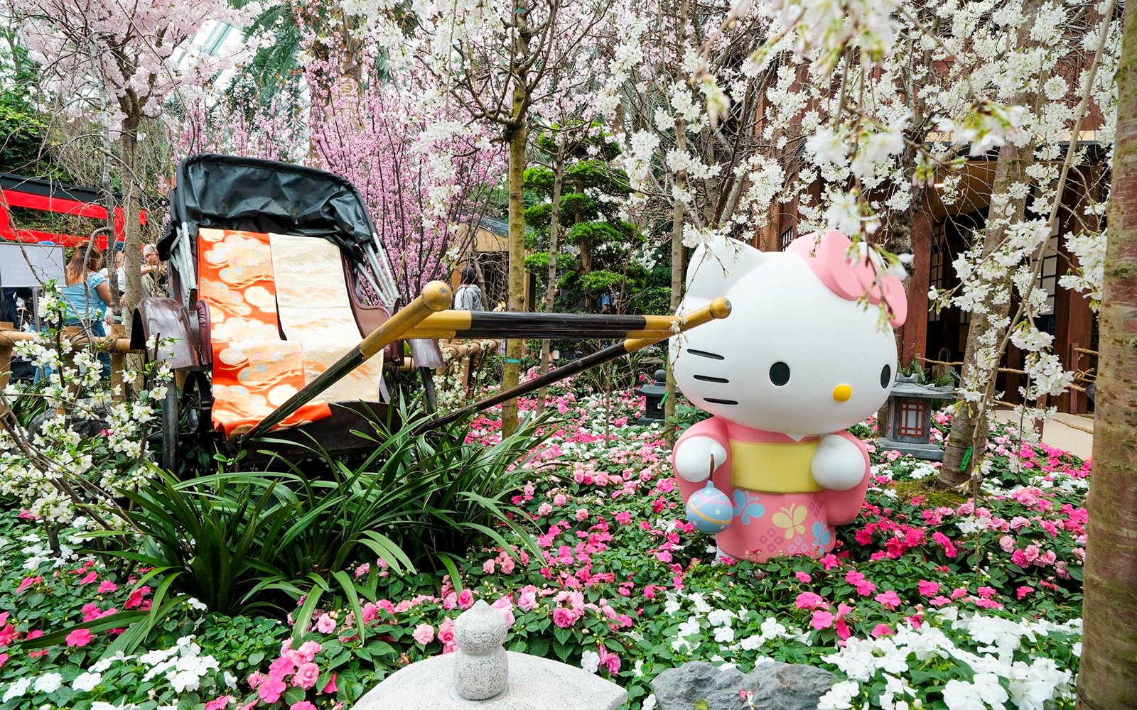 Hello Kitty statue among cherry blossoms at Gardens by the Bay Sakura event.