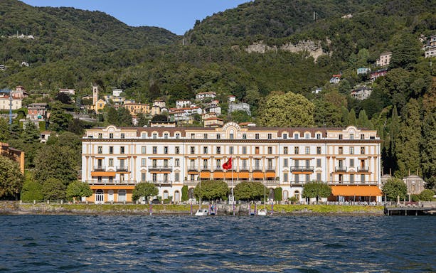 Villa d'Este on Lake Como with hillside backdrop and waterfront view.