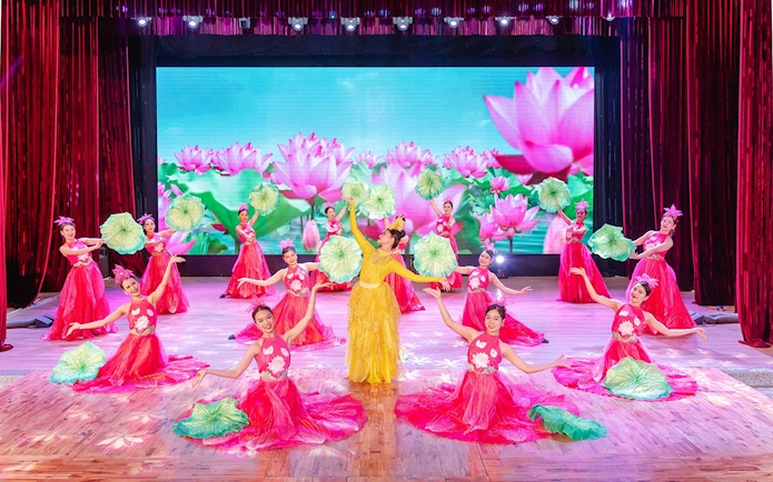 Performers in traditional Ao Dai costumes during a cultural show in Da Nang.