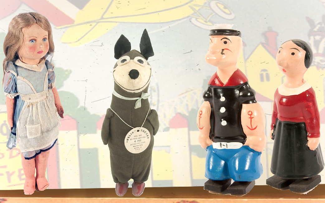 Vintage toys display at Mint Museum of Toys, featuring classic dolls and figurines.