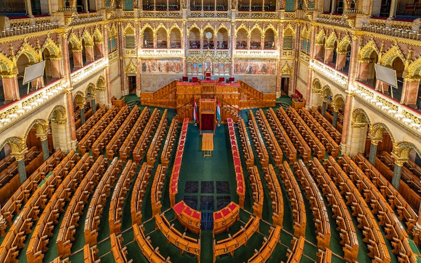 Hungarian Parliament interior with ornate seating in Budapest.