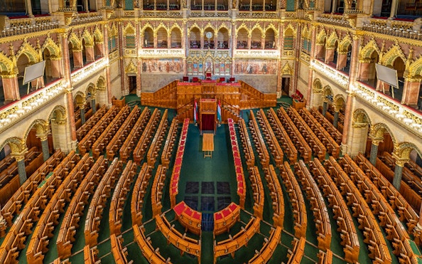 Hungarian Parliament interior with ornate seating in Budapest.