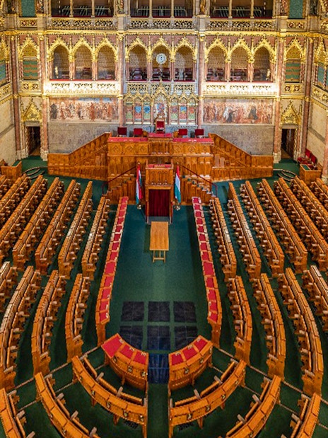 Hungarian Parliament interior with ornate seating in Budapest.
