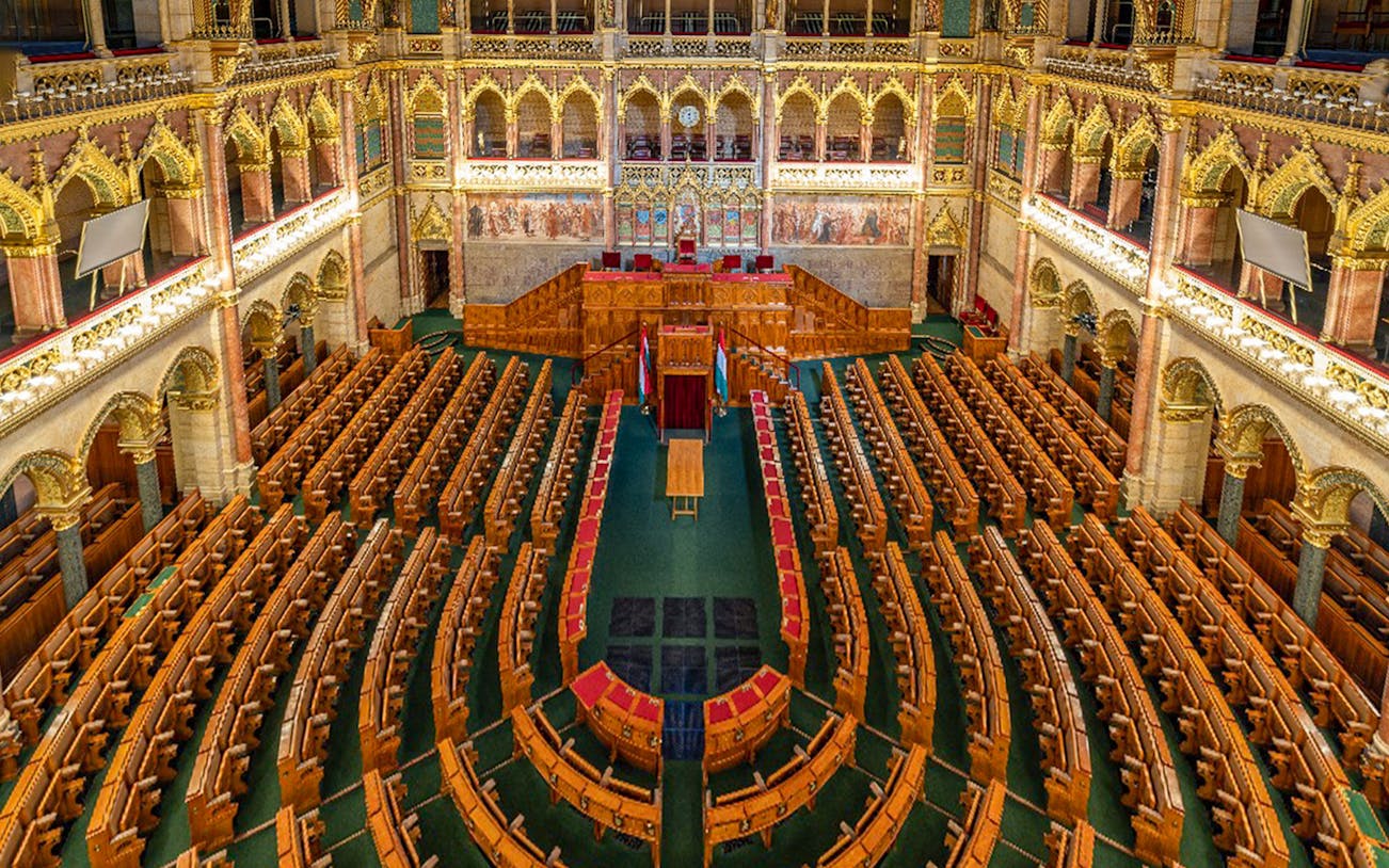 Hungarian Parliament interior with ornate seating in Budapest.