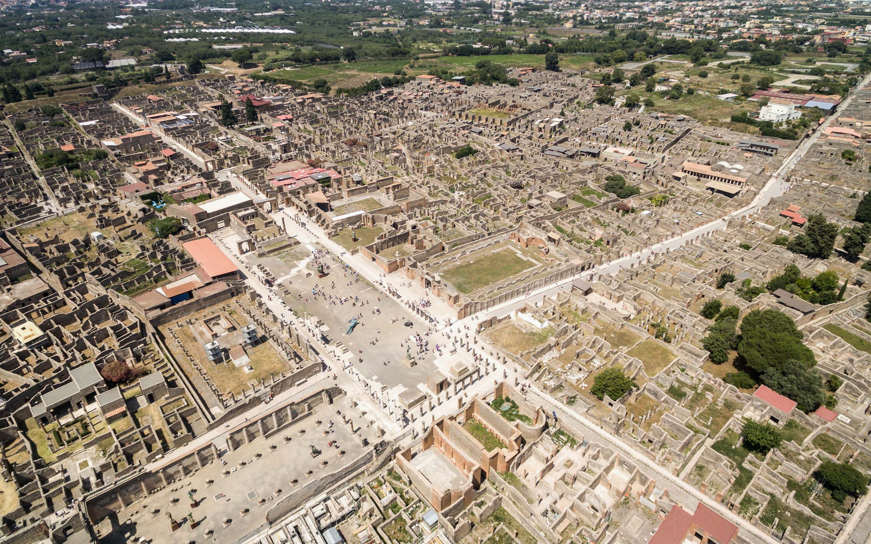 Aerial view of Herculaneum ruins in Italy, showcasing ancient streets and structures.