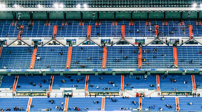 Bernabeu Stadium seating area in Madrid, showcasing "Real Madrid" signage.