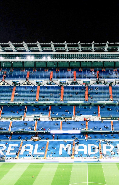 Bernabeu Stadium seating area in Madrid, showcasing "Real Madrid" signage.