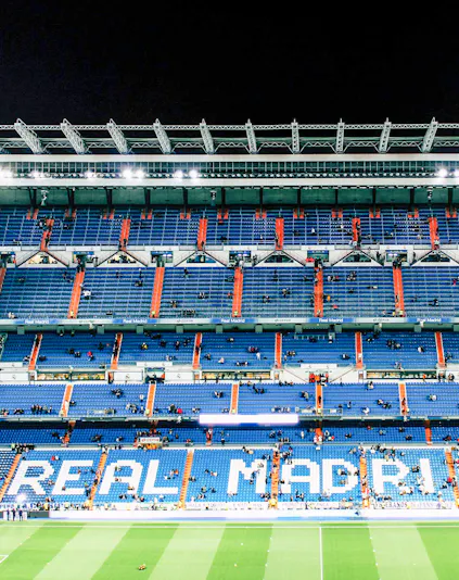 Bernabeu Stadium seating area in Madrid, showcasing "Real Madrid" signage.