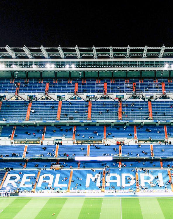 Bernabeu Stadium seating area in Madrid, showcasing "Real Madrid" signage.
