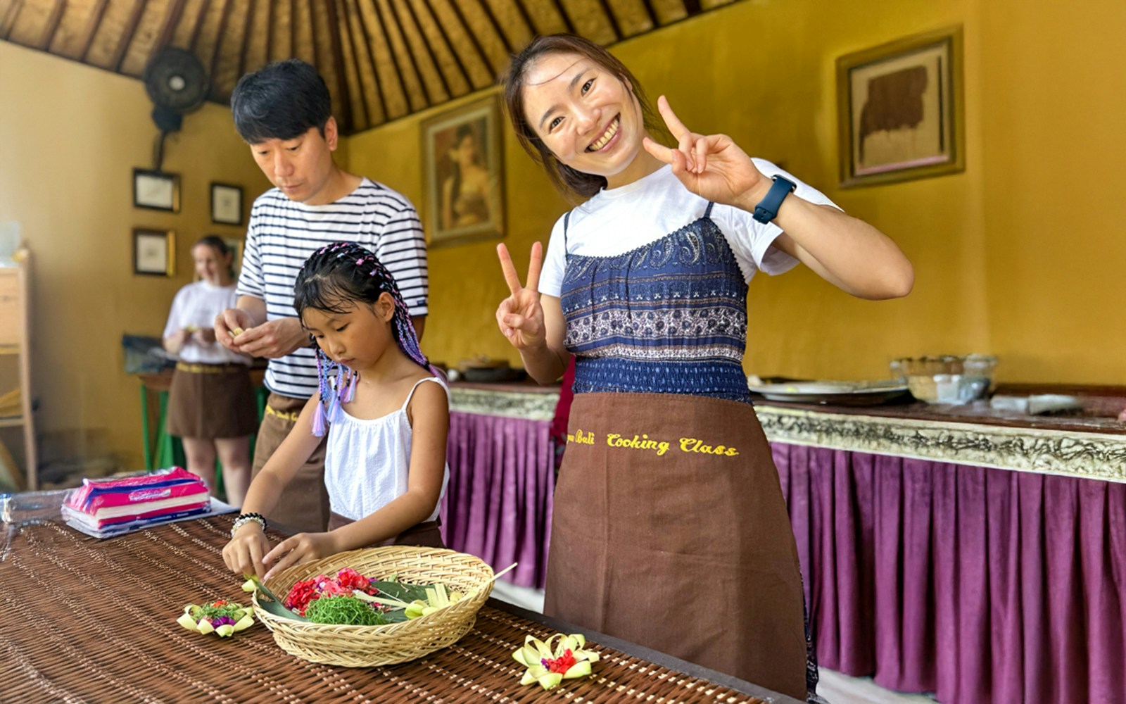 Ubud cooking class participants preparing traditional Balinese dishes