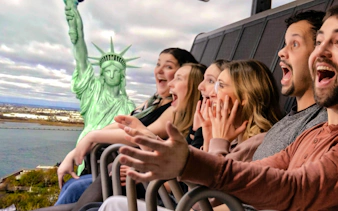Guests enjoying a simulated ride at RiseNY with a view of the Statue of Liberty.