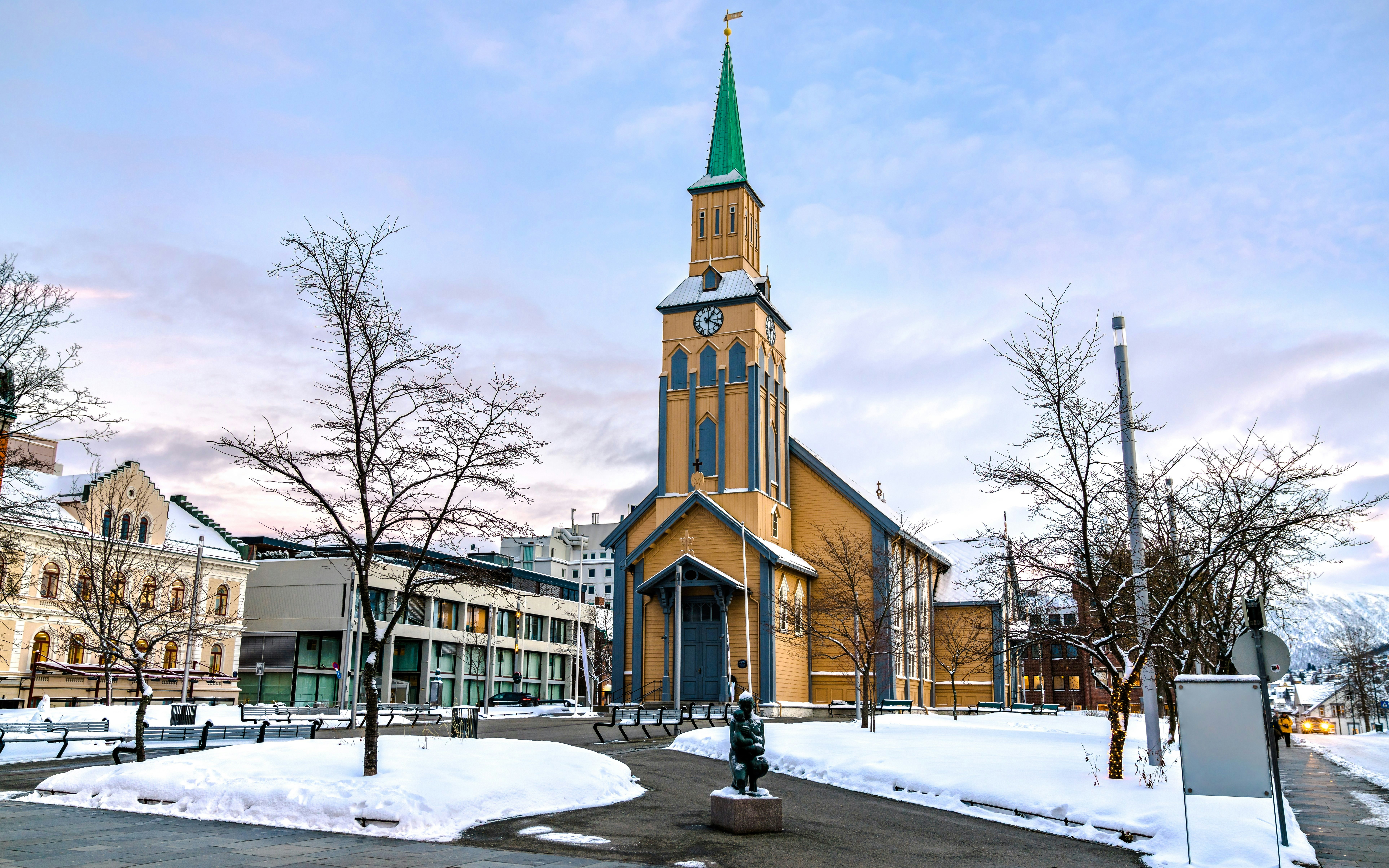Tromsø Cathedral with snow-covered surroundings in Tromsø, Norway.
