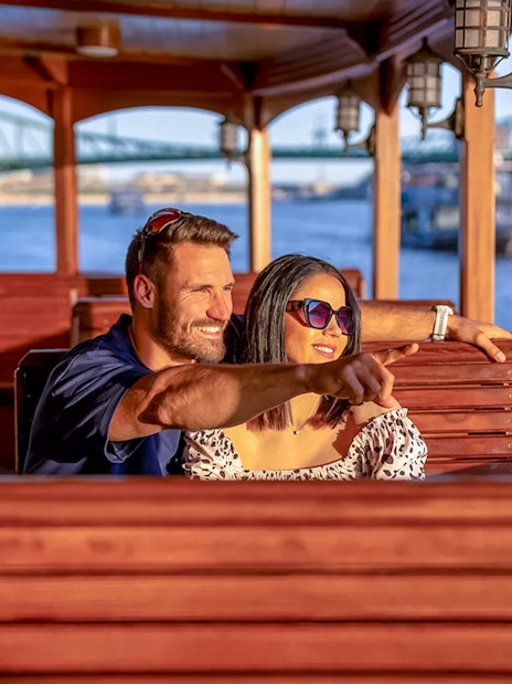 Guests enjoying a scenic view on a historic cruise in Budapest.