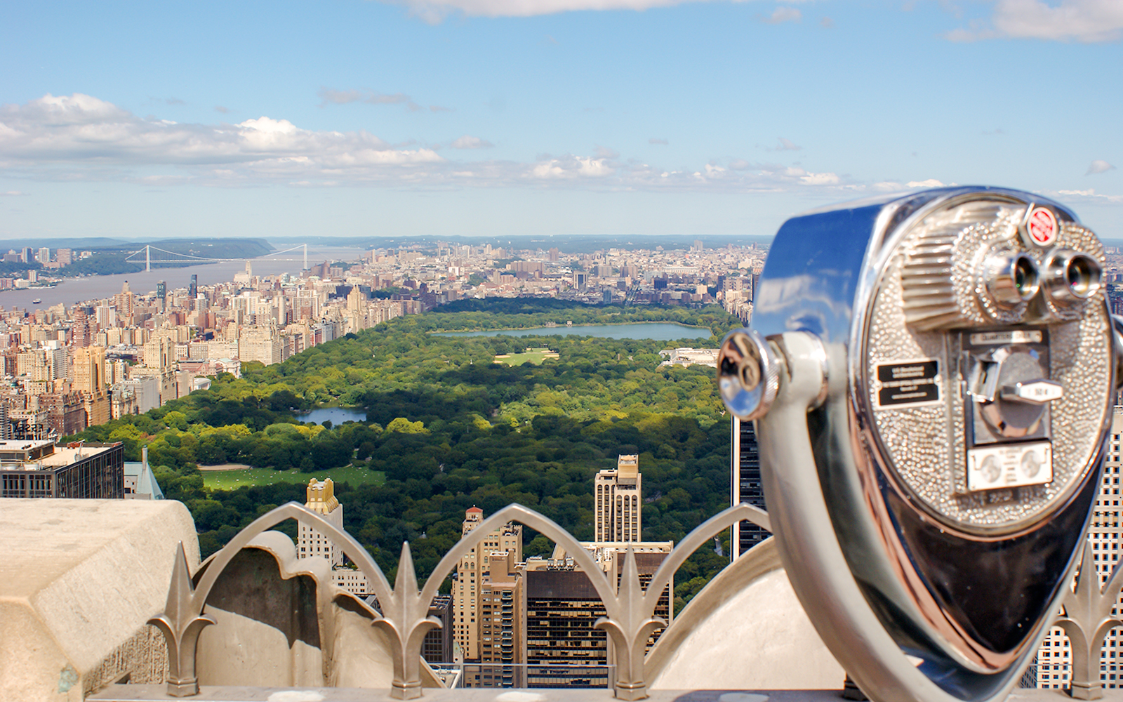 Skyline view of Manhattan and Central Park from a New York City observation deck.