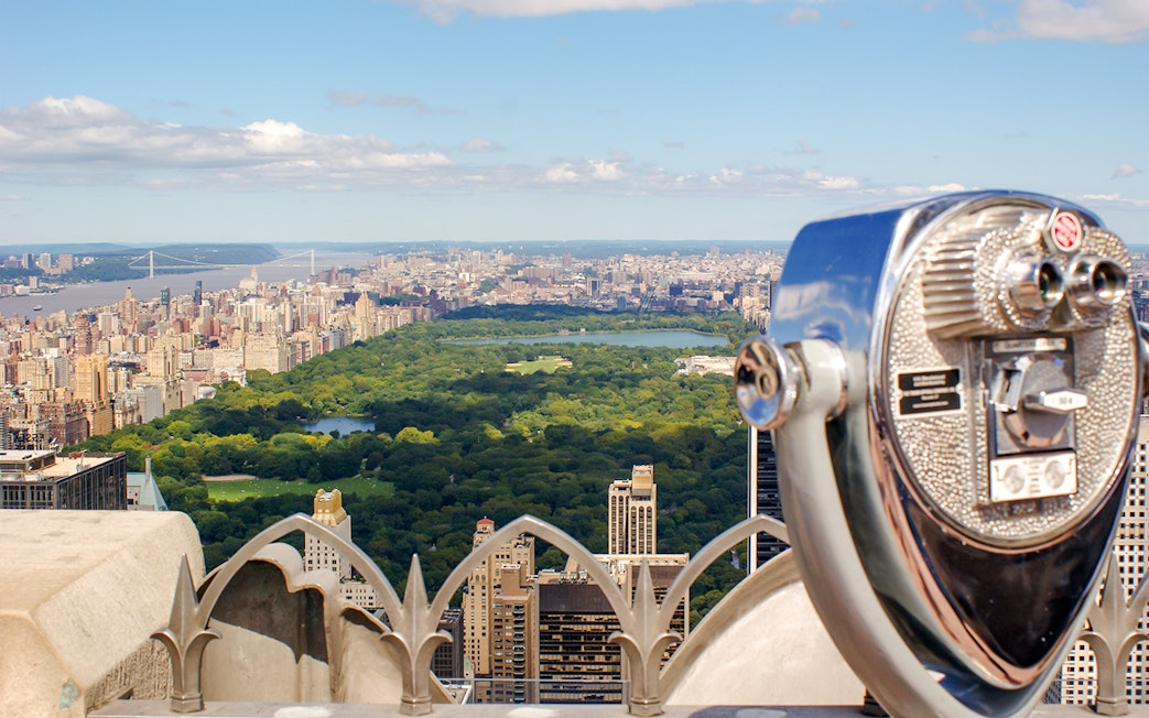 Skyline view of Manhattan and Central Park from a New York City observation deck.