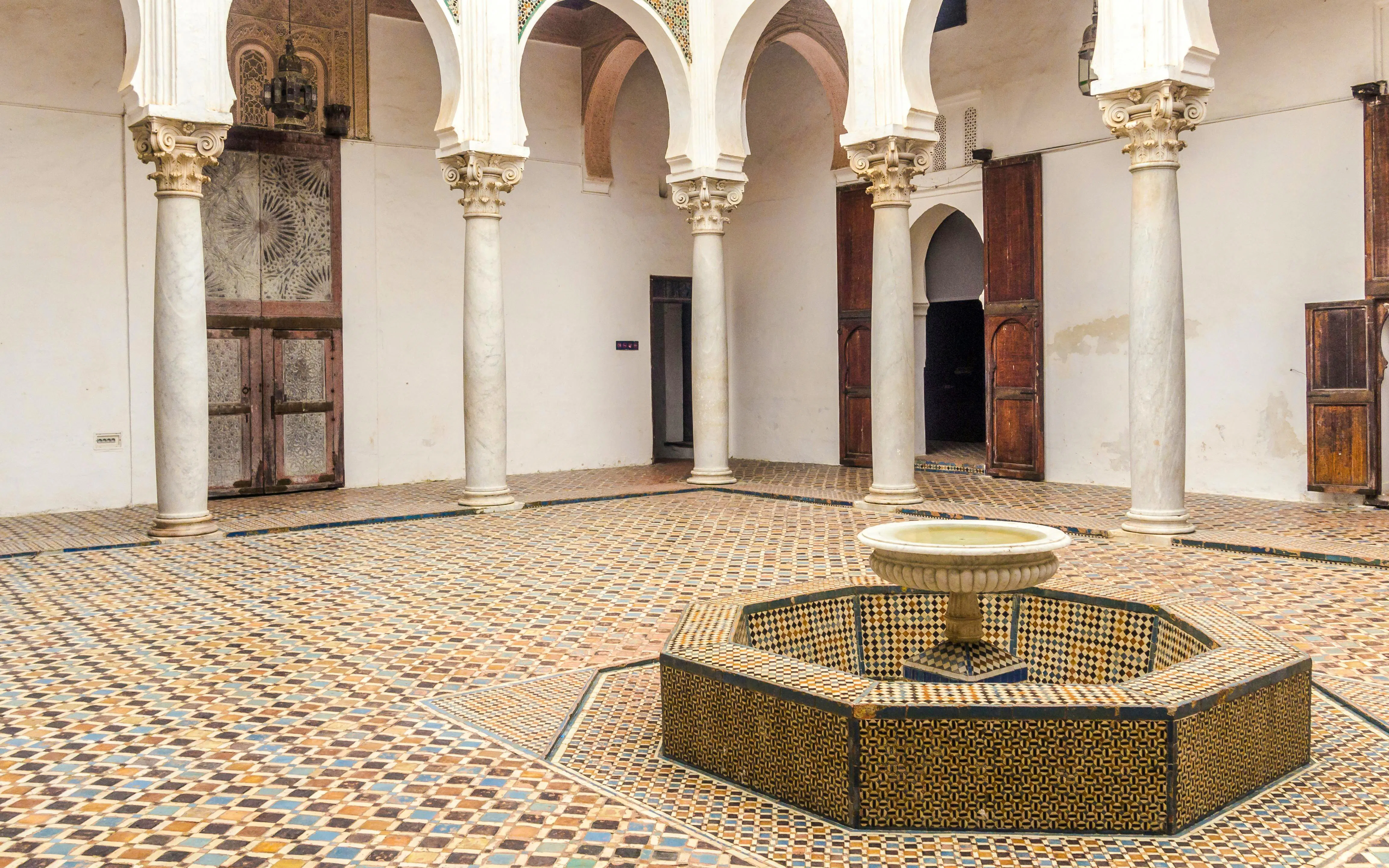 Tangier's Kasbah courtyard with mosaic tiles and central fountain.