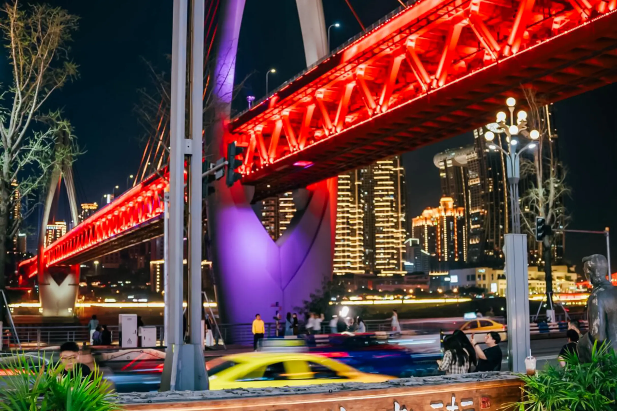 Chongqing night view with illuminated bridge and city skyline.