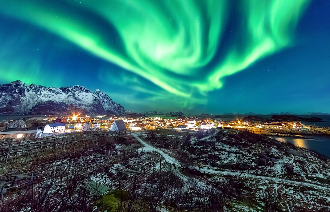 northern lights visible in beautiful night sky over tromso