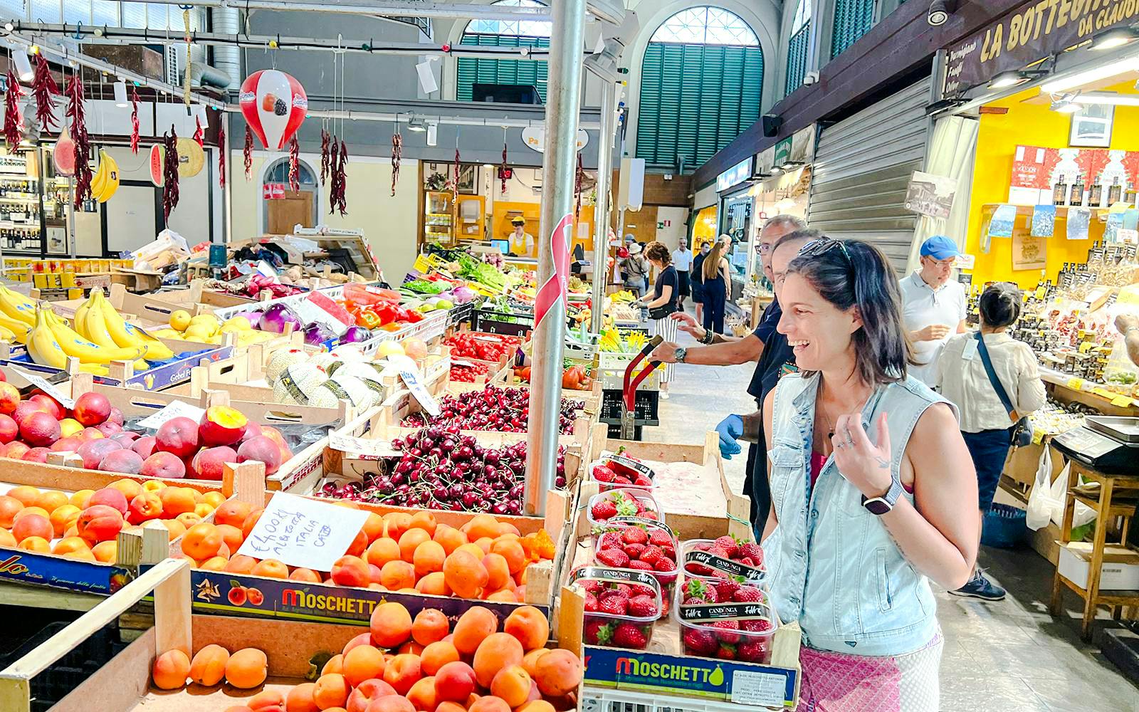 Market visit during small group cooking class in Florence, featuring fresh produce and local vendors.