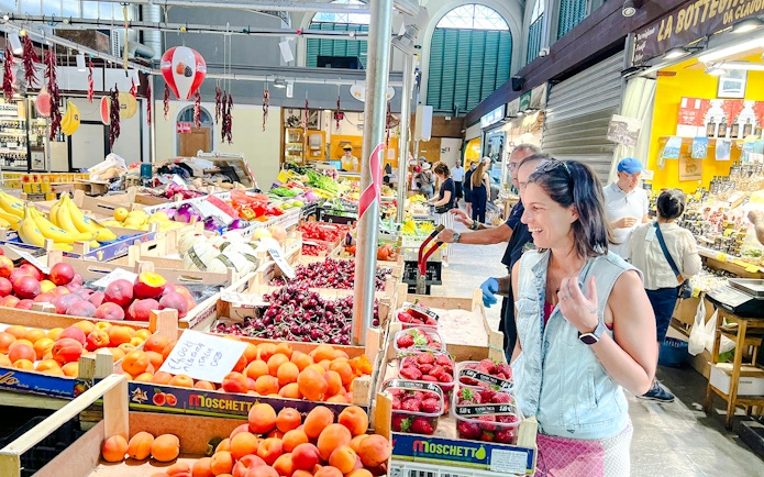 Market visit during small group cooking class in Florence, featuring fresh produce and local vendors.