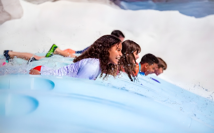 Kids enjoying a water slide at Walt Disney World Resort, Orlando.