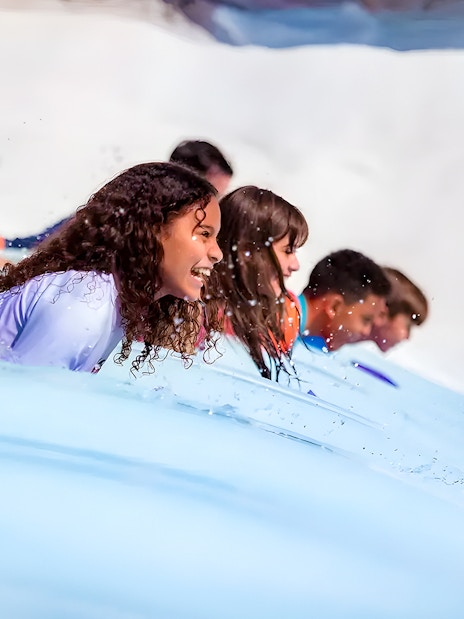 Kids enjoying a water slide at Walt Disney World Resort, Orlando.