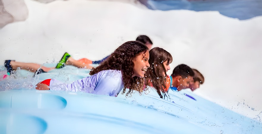 Kids enjoying a water slide at Walt Disney World Resort, Orlando.