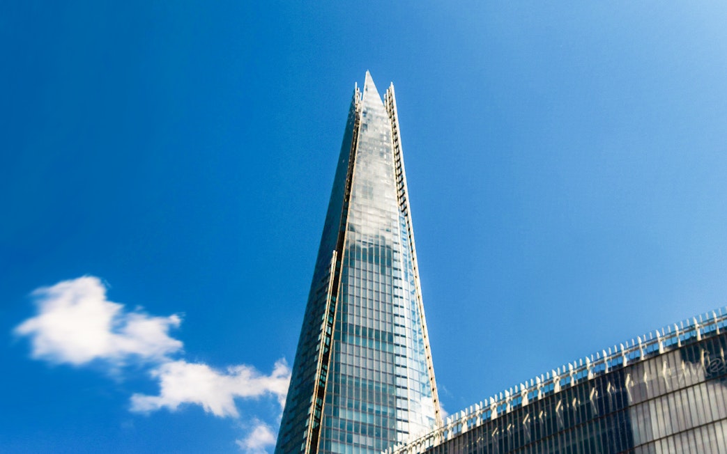 The Shard skyscraper against a clear blue sky in London.