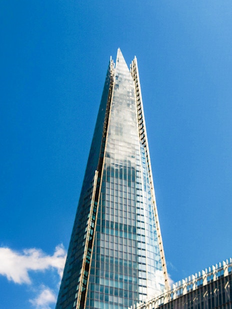 The Shard skyscraper against a clear blue sky in London.