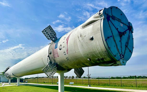 Falcon 9 rocket display at Houston Space Center, showcasing space exploration technology.