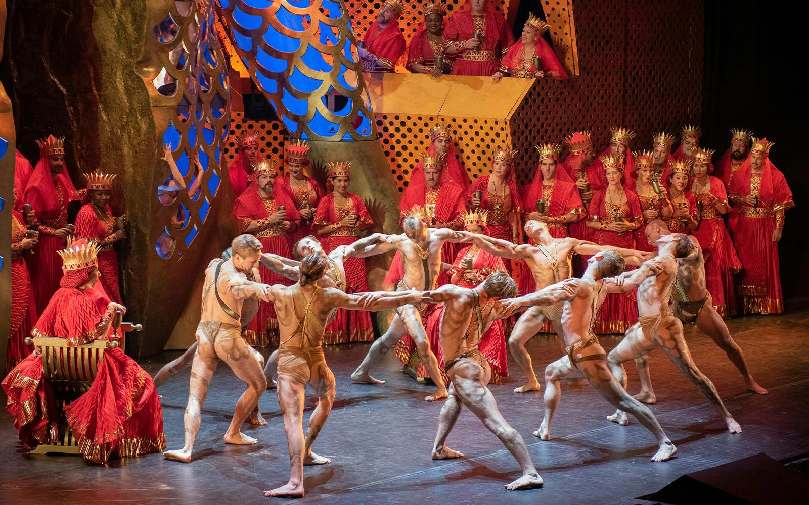 Samson et Dalila performance on Broadway with dancers and choir in vibrant costumes.