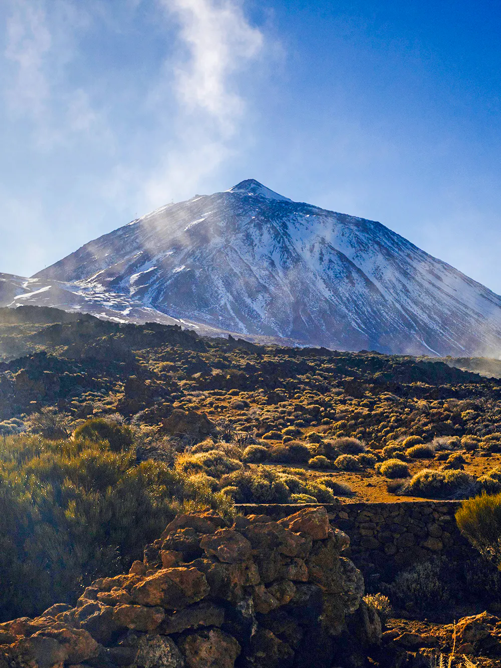 Mount Teide with rocky terrain and sparse vegetation in Canarian Islands, Spain.