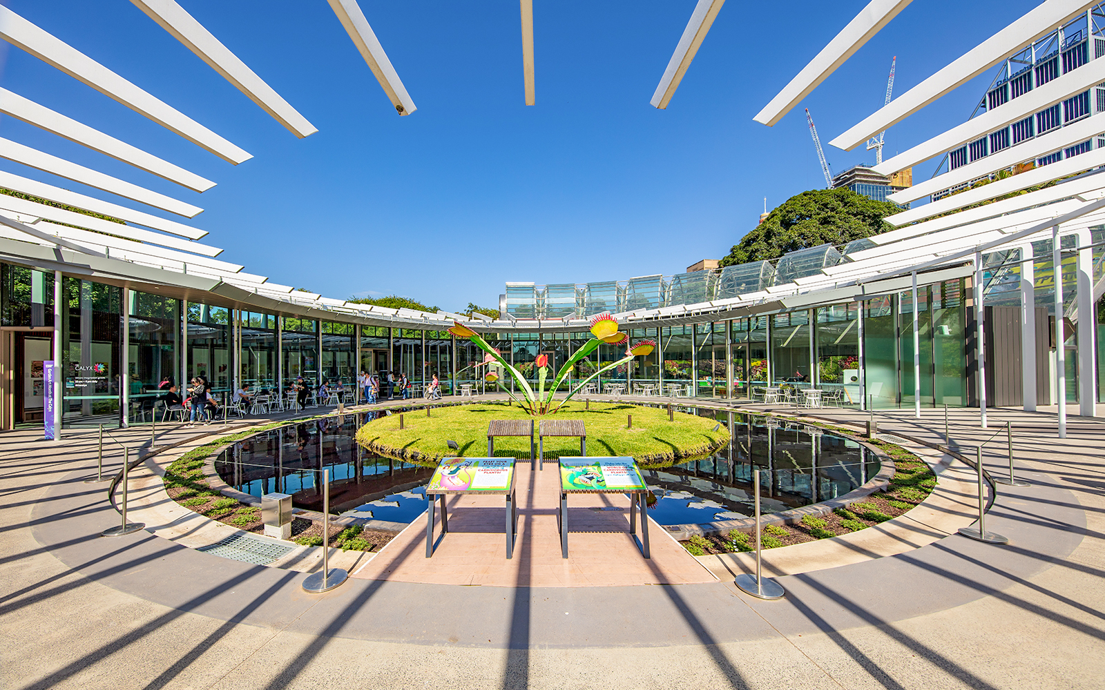 Royal Botanic Garden Sydney, Calyx exhibition space with visitors and plant displays.