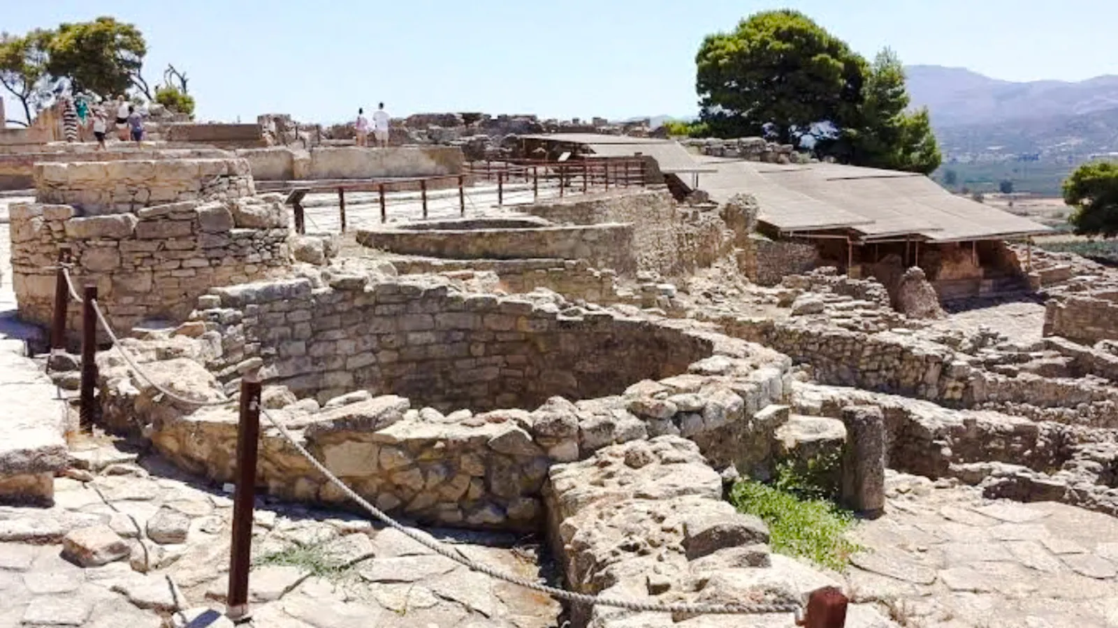 Phaistos Palace ruins with stone structures and pathways, Crete, Greece.