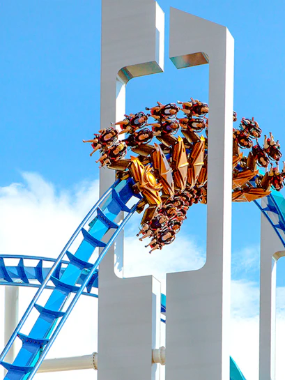 GateKeeper roller coaster at Cedar Point with riders on a blue track.