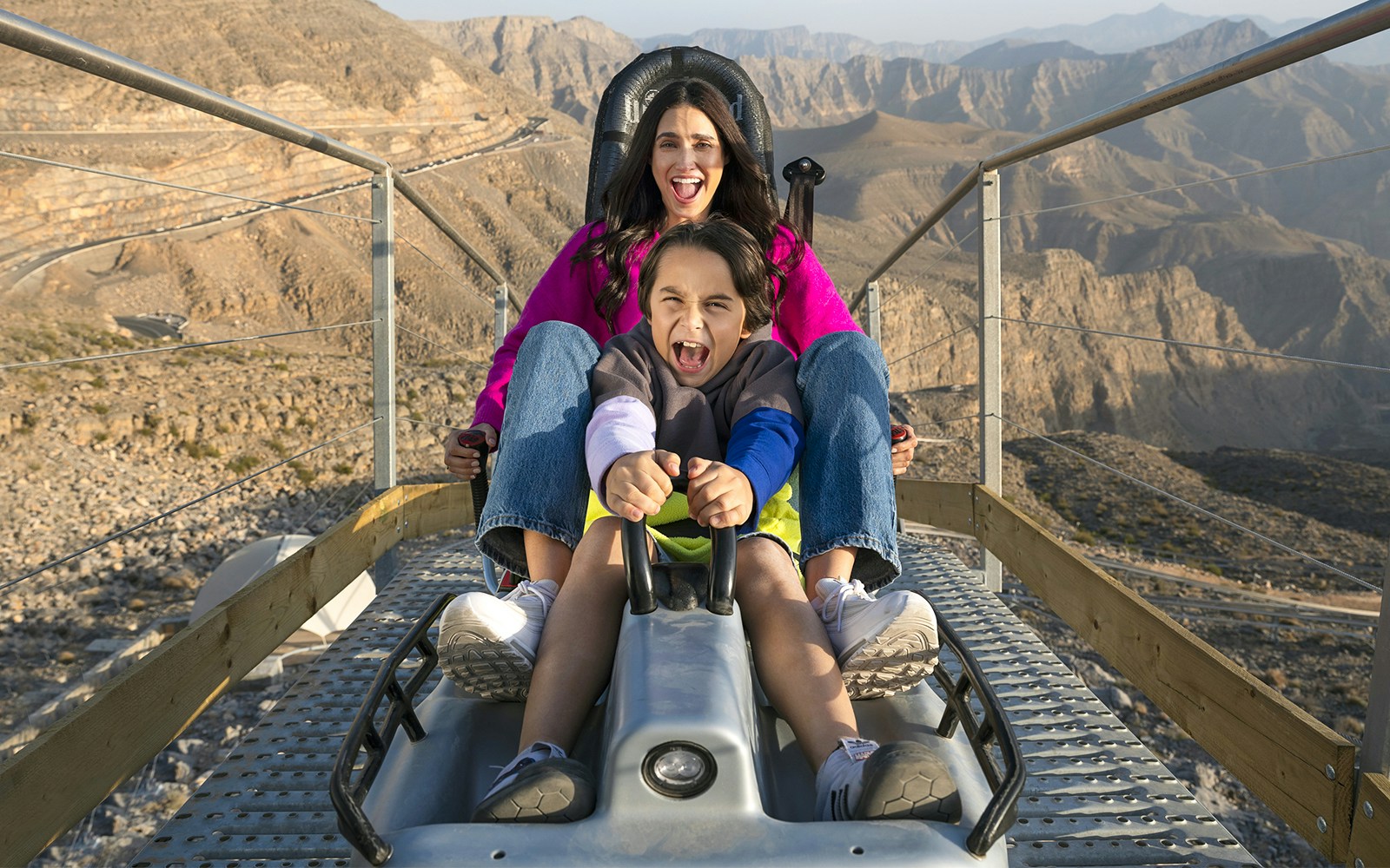 A mother and her son on the Jebel Jais sledder