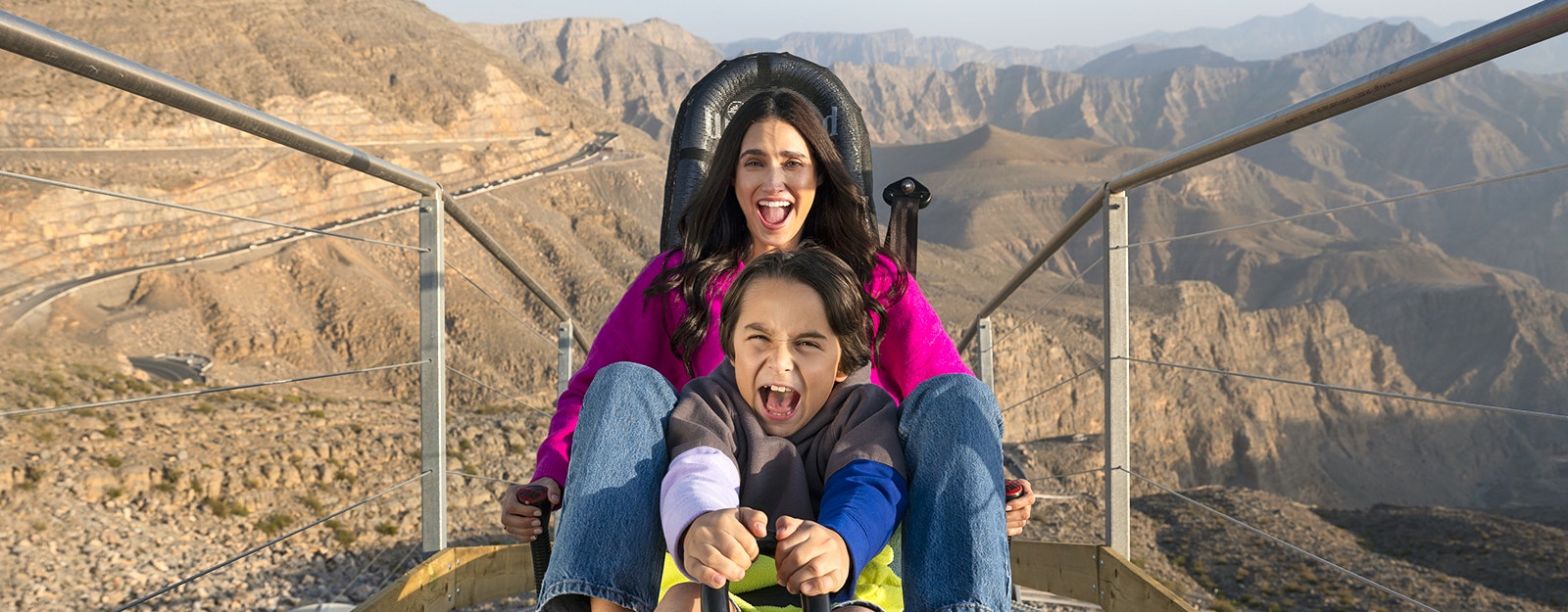 A mother and her son on the Jebel Jais sledder