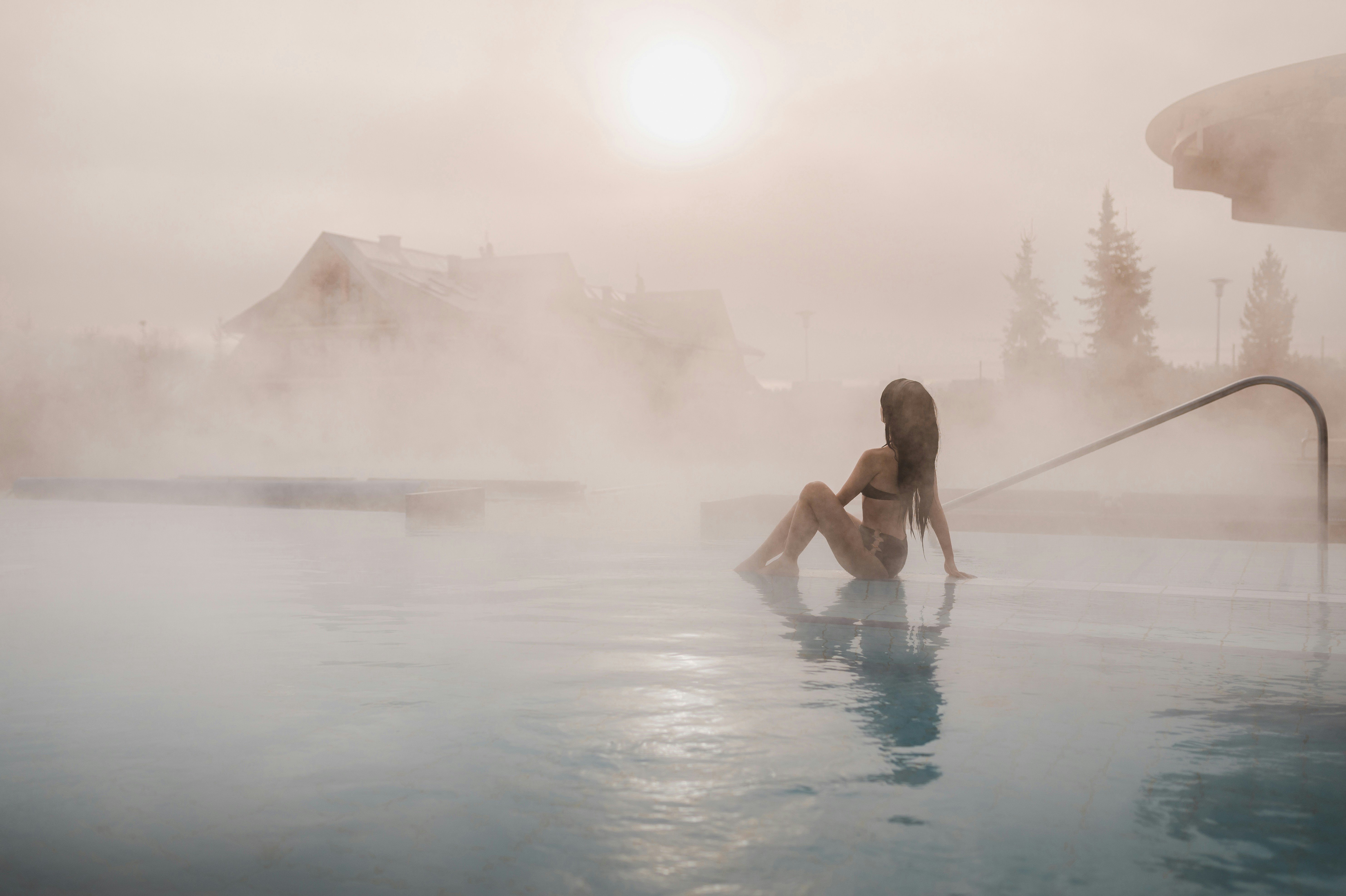 Woman relaxing in thermal hot springs, Zakopane, surrounded by scenic mountain views.