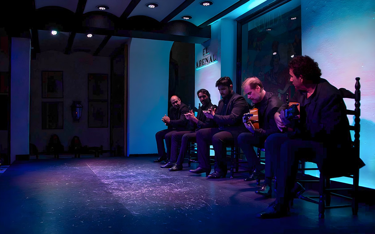 Musicians performing at Tablao El Arenal Flamenco show in Seville.