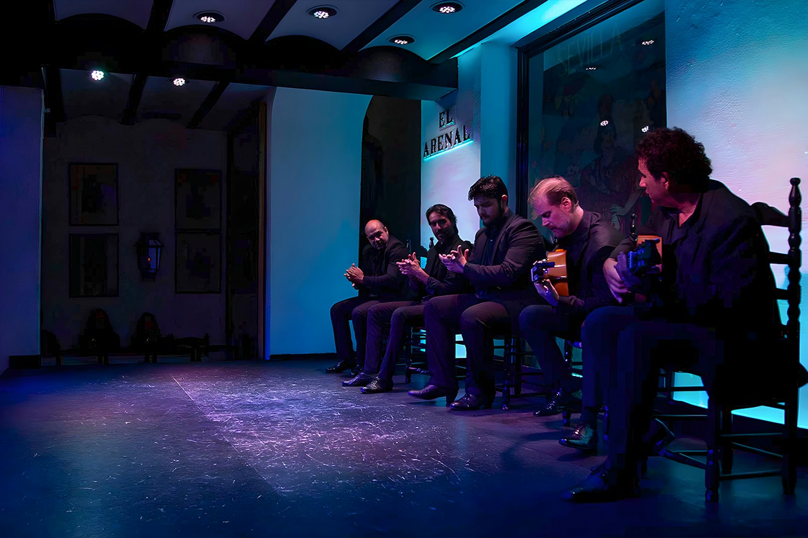 Musicians performing at Tablao El Arenal Flamenco show in Seville.