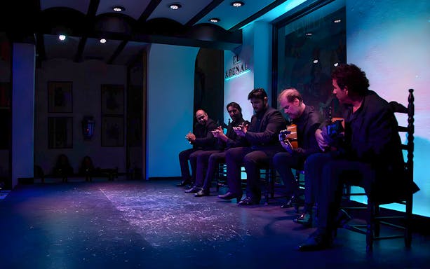 Musicians performing at Tablao El Arenal Flamenco show in Seville.