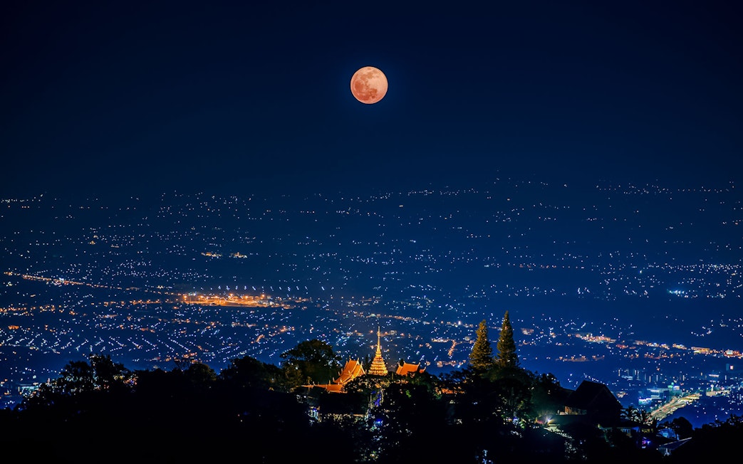 Lunar eclipse over Wat Phrathat Doi Suthep Temple, Chiang Mai, Thailand, 2020.