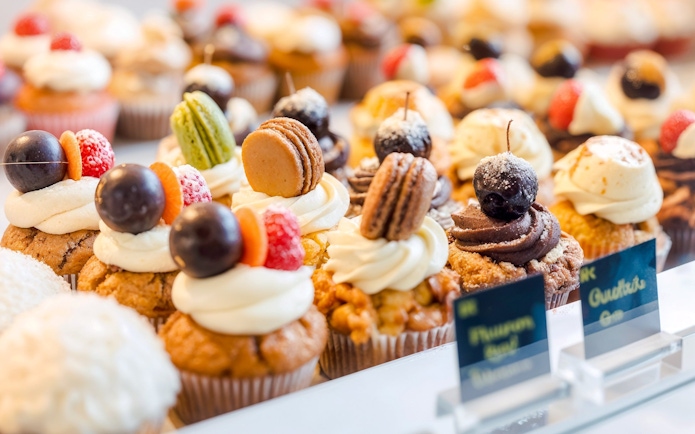 Pastries with macarons and fruit toppings at the Markthal in Rotterdam.