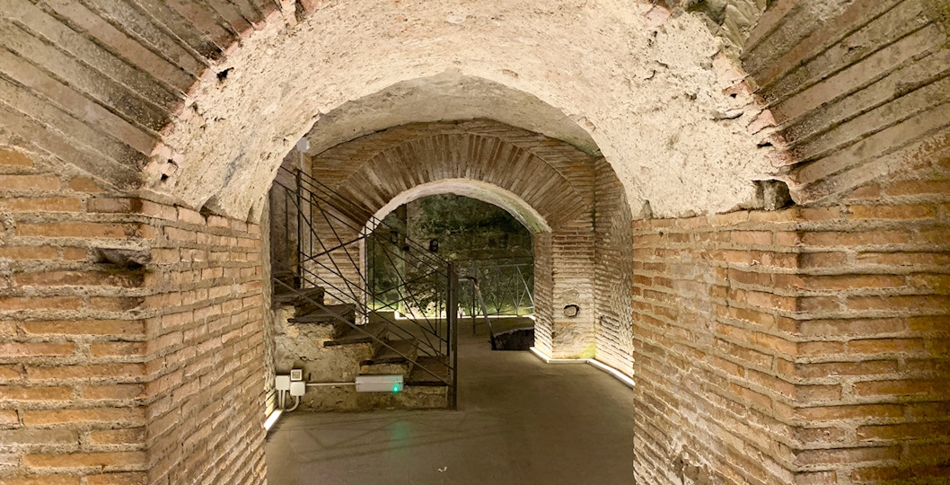 Naples underground tour showcasing Greek Roman theater ruins at Napoli Sotterranea.