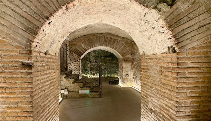 Naples underground tour showcasing Greek Roman theater ruins at Napoli Sotterranea.