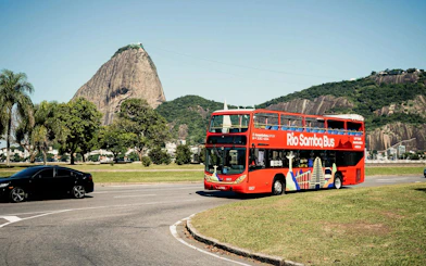 Rio Samba Bus in front of Sugarloaf Mountain, Rio de Janeiro, on a hop-on hop-off tour.