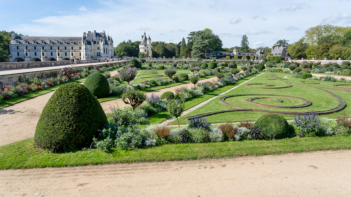 Château de Chenonceau's Garden of Diana de Poitiers with manicured hedges and floral designs.