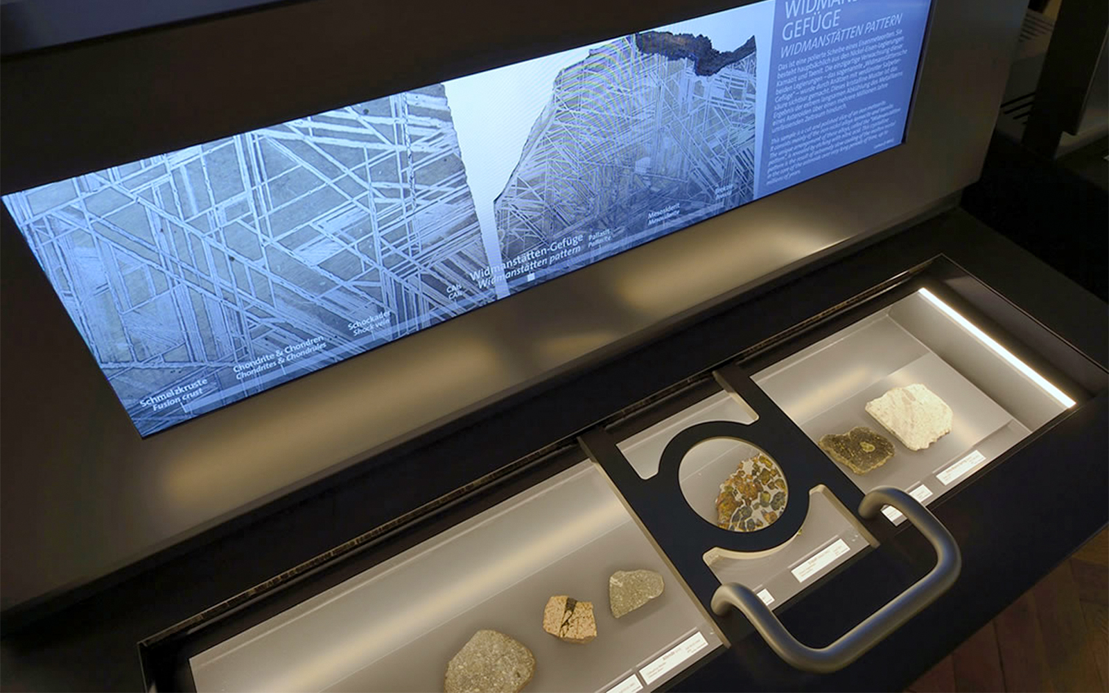 Impact Simulator with magnifying glass and screen at Natural History Museum, Vienna.