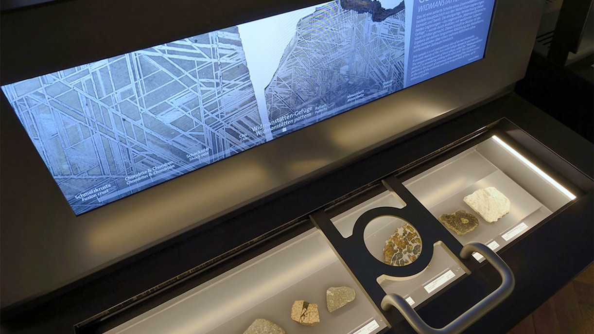 Impact Simulator with magnifying glass and screen at Natural History Museum, Vienna.